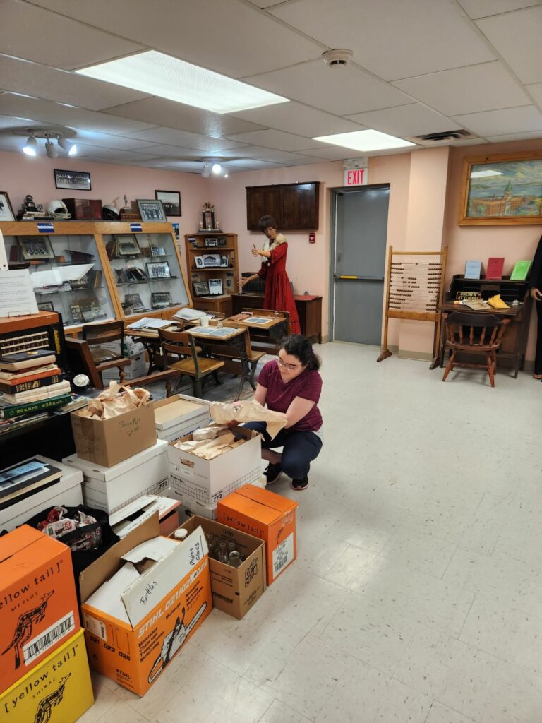 Magalie, working in a musuem.