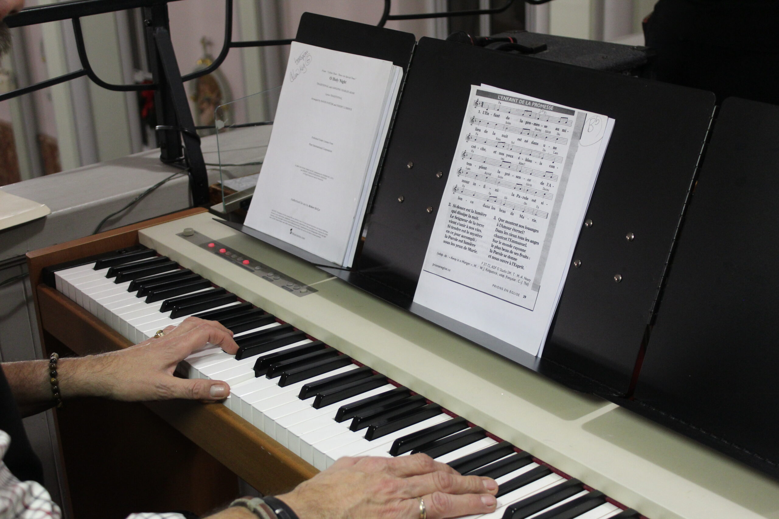 Close-up of someone playing the piano.